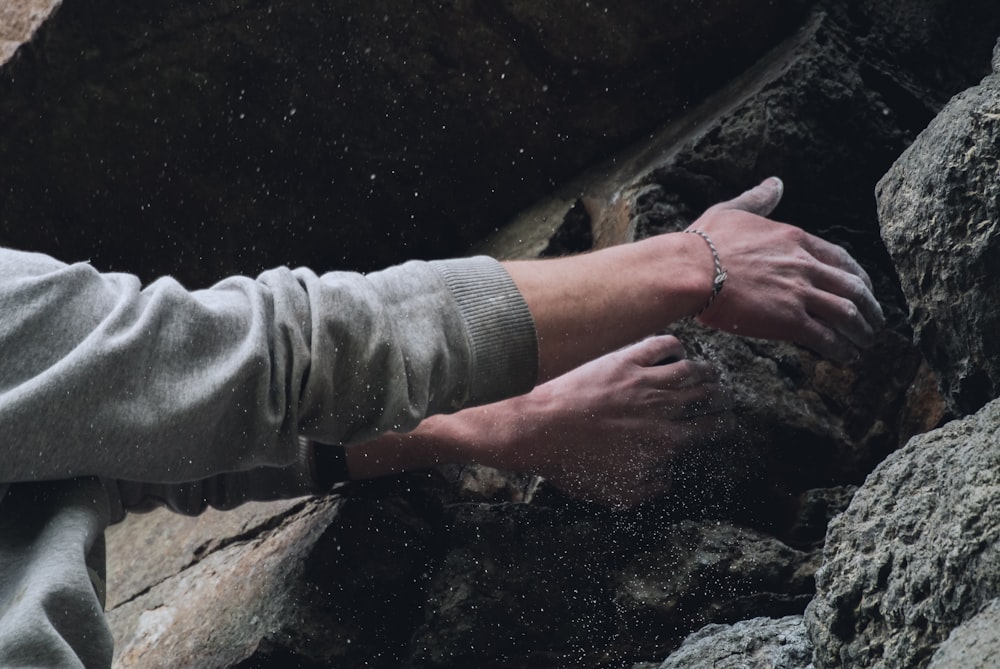 person touching rock