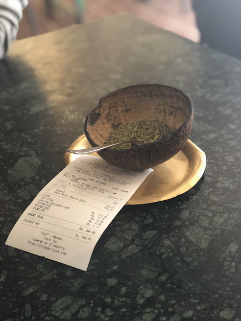 FSSAI certificate displayed on a wooden desk with a pen and glasses