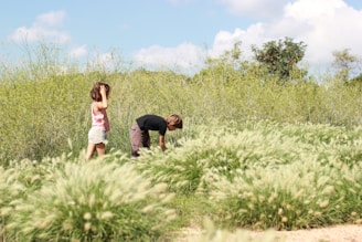 Children exploring a meadow during an educational nature excursion.