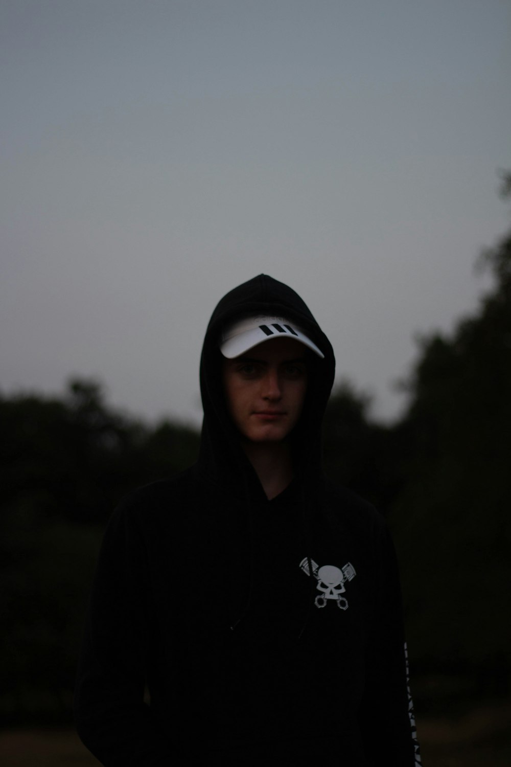 man wearing black hoodie