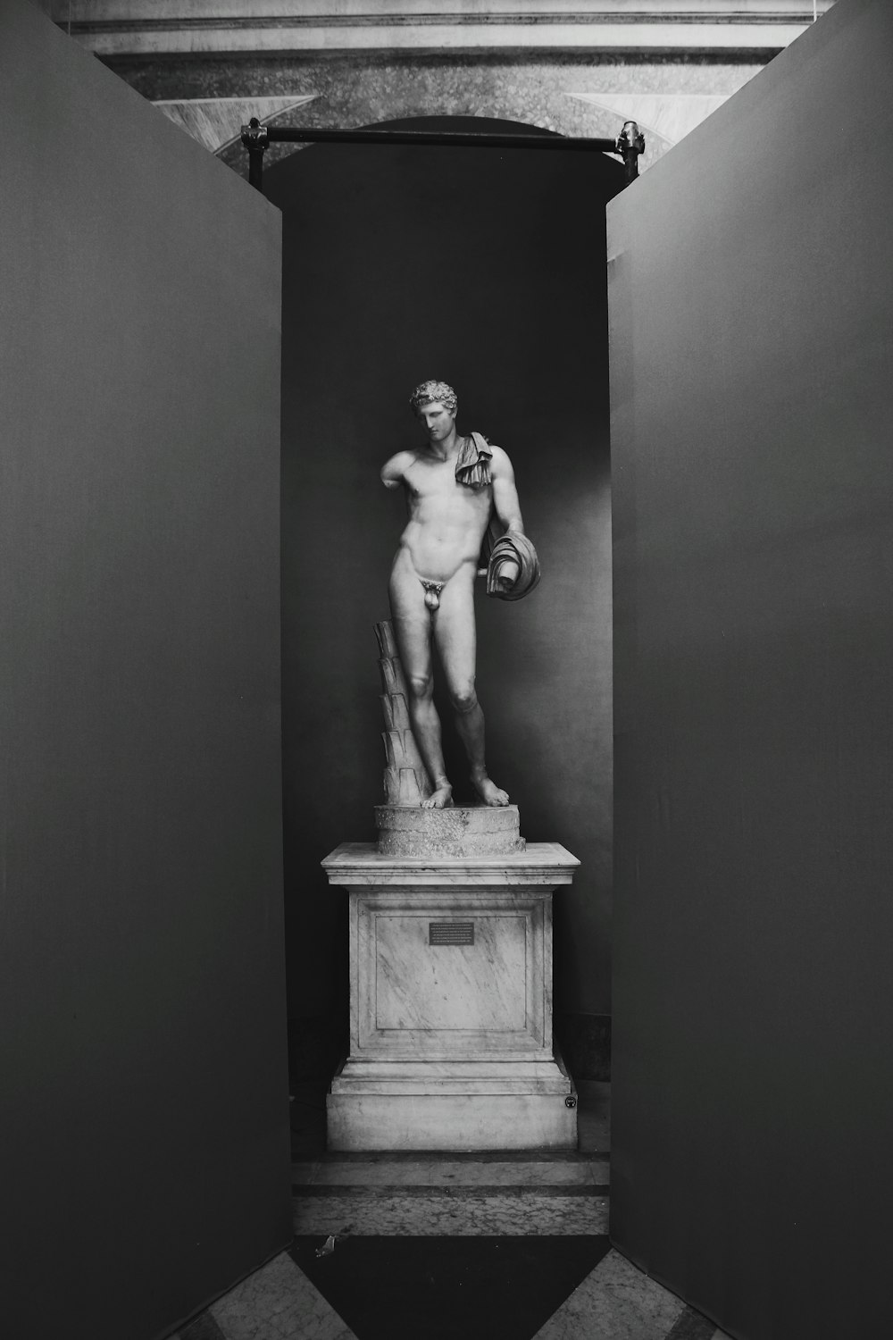grayscale photo of male statue