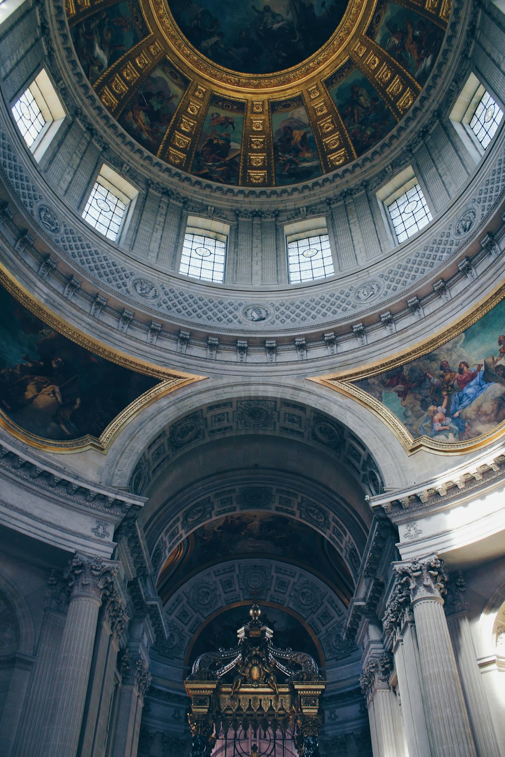 a church with a large painting on the ceiling