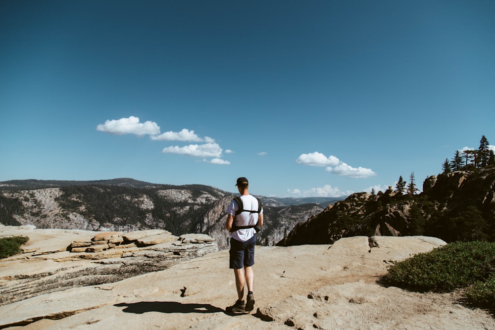 man standing on mountain