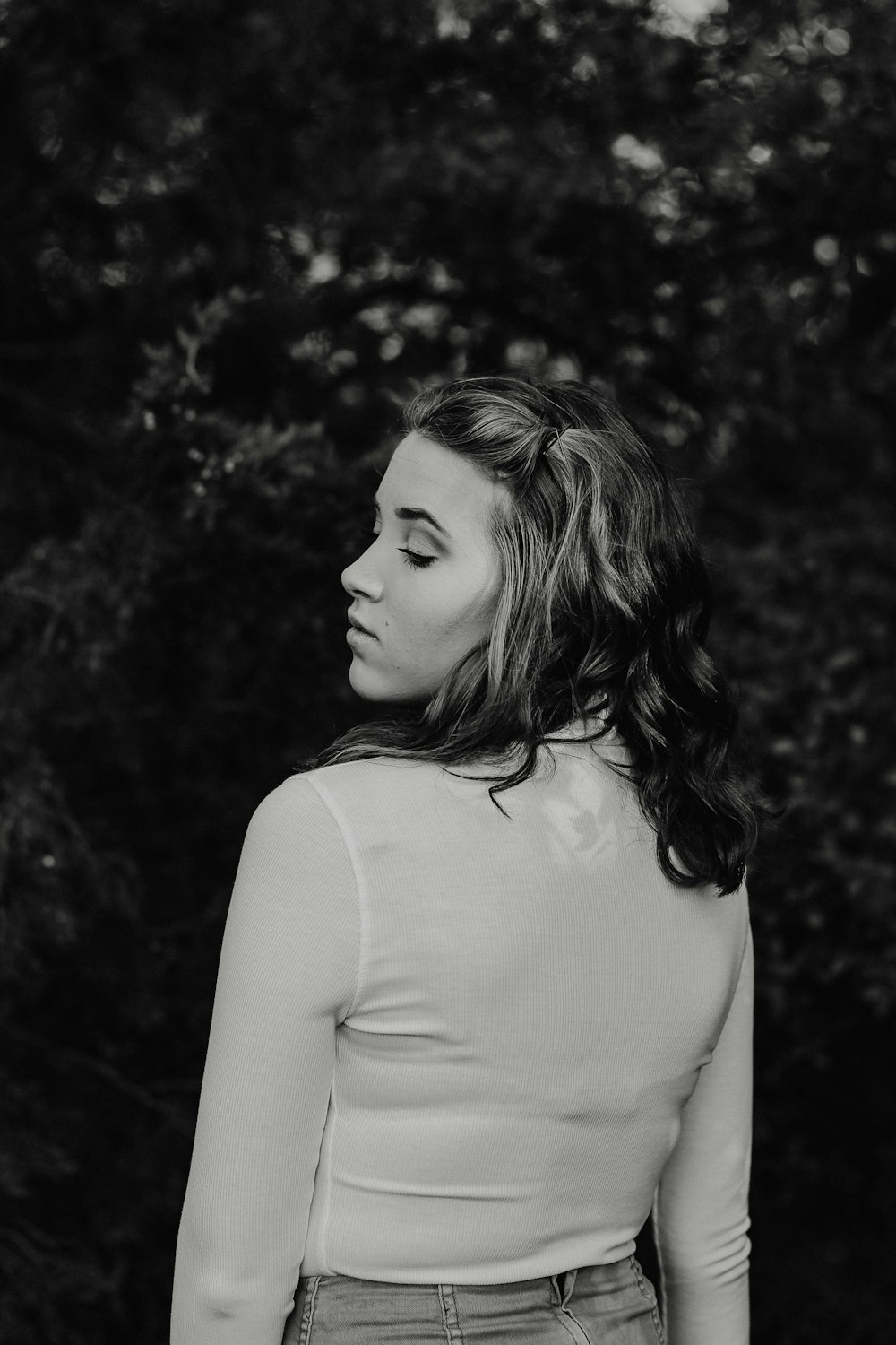 grayscale photography of woman looking at her left side