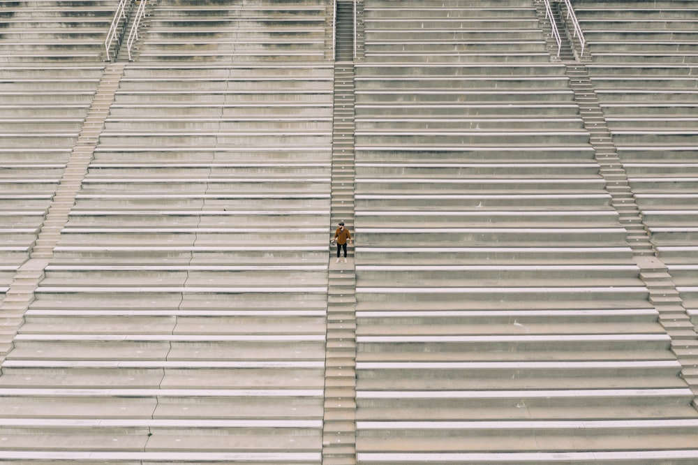 a person standing in the middle of a stadium