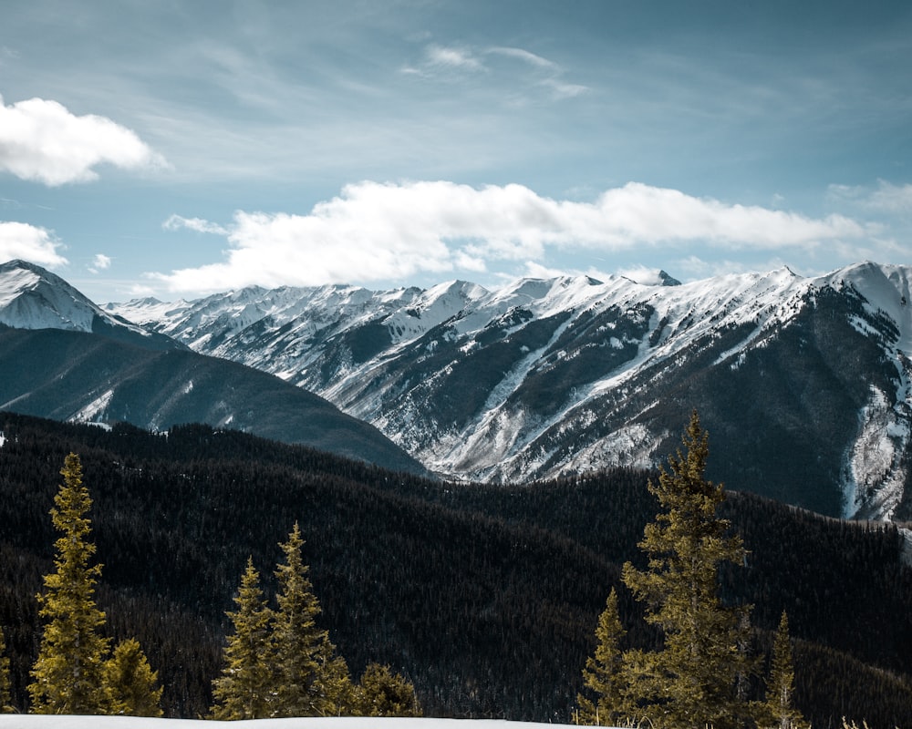 snow covered mountain range during daytime