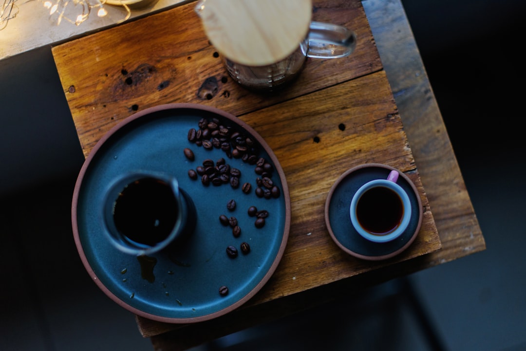 flat lay photography of plate and coffee cup on table
