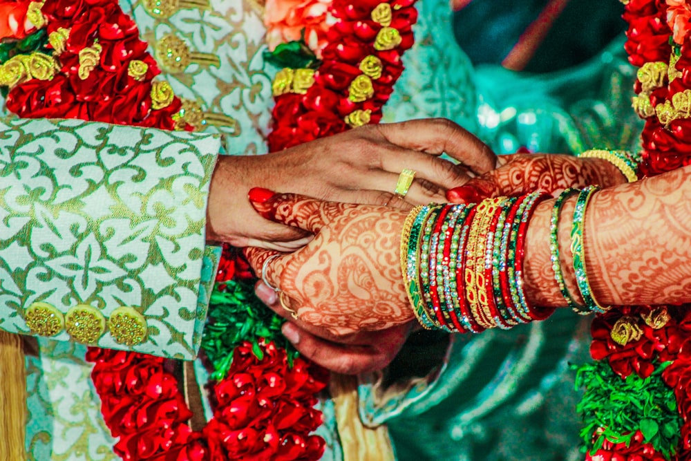 mendhi tattoo on person's hand