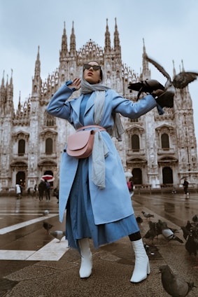 woman near pigeons