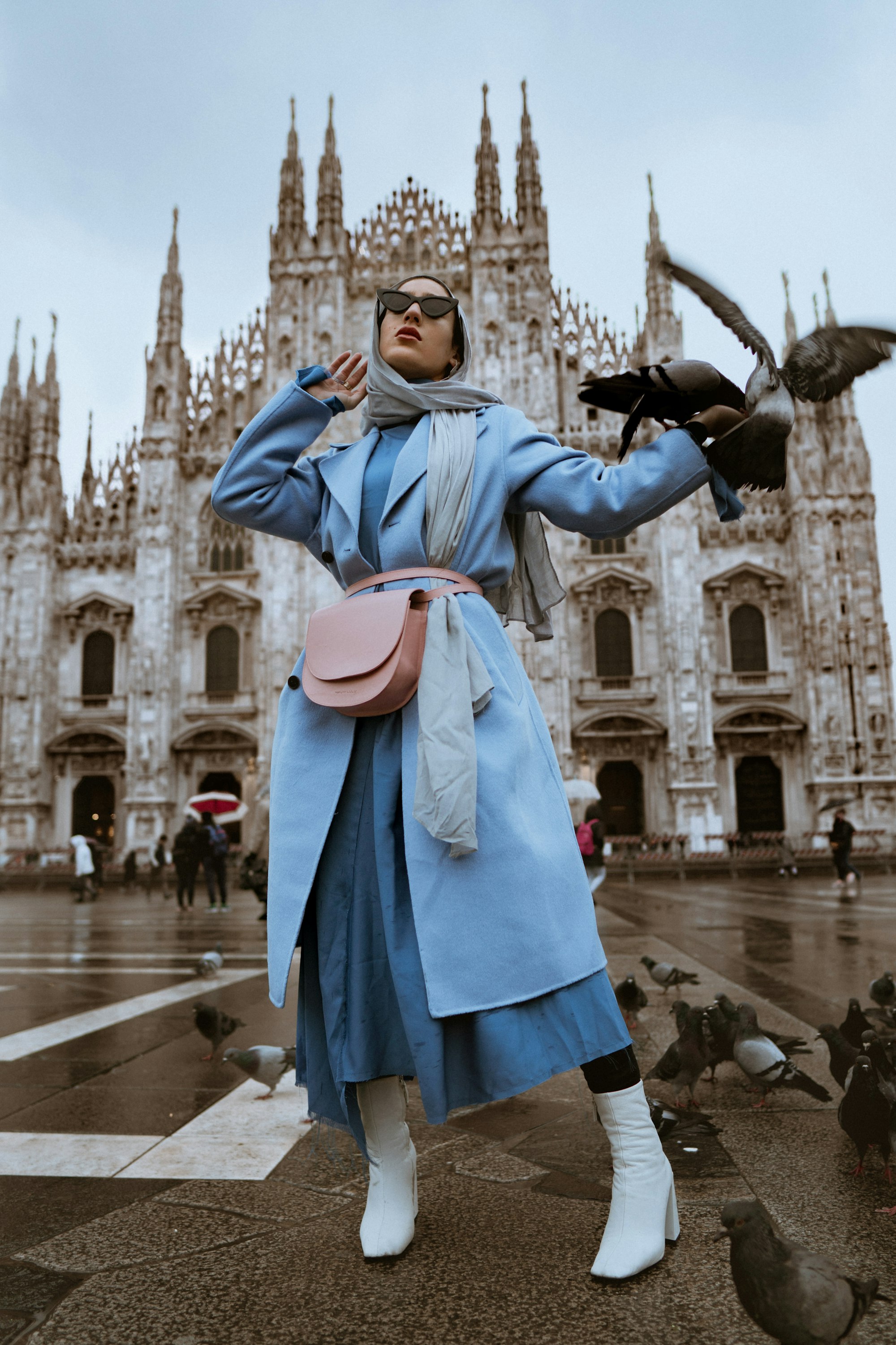 I was invited to attend Milan Fashion week in a February of 2018. It was my first time in Milan, and I was astounded at the amount of beautiful architecture it has around the city. I wanted to capture that but also tie in fashion along with it. As we were shooting, these birds started passing all over the place! It was magical! I give my model credit for standing so still. The shot was taken at the Duomo in Milan, Italy. Photo be me @alexiroseproductions model: @marwaatik