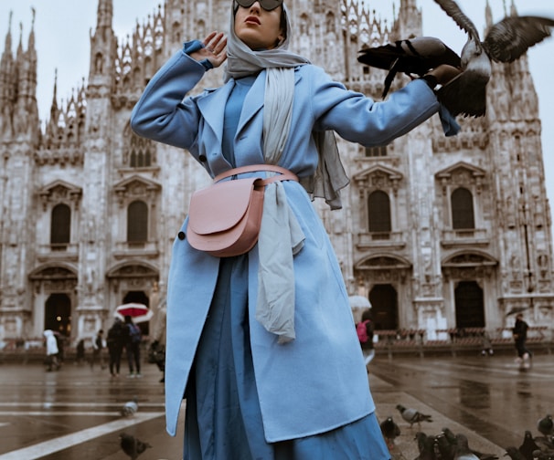 woman near pigeons