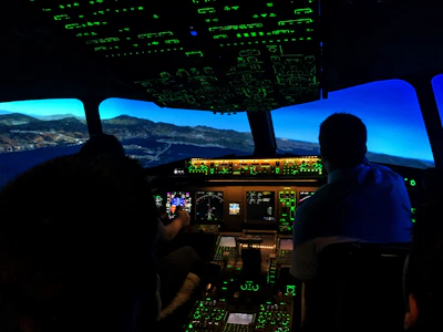 Close-up of a pilot practicing in a flight simulator cockpit.