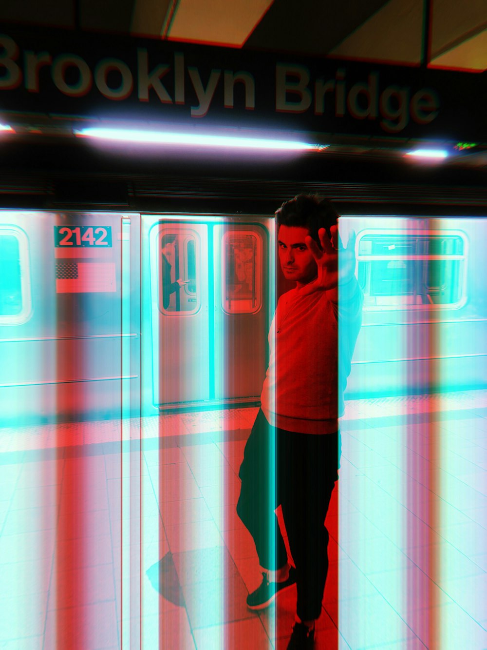 a man standing in front of a train station