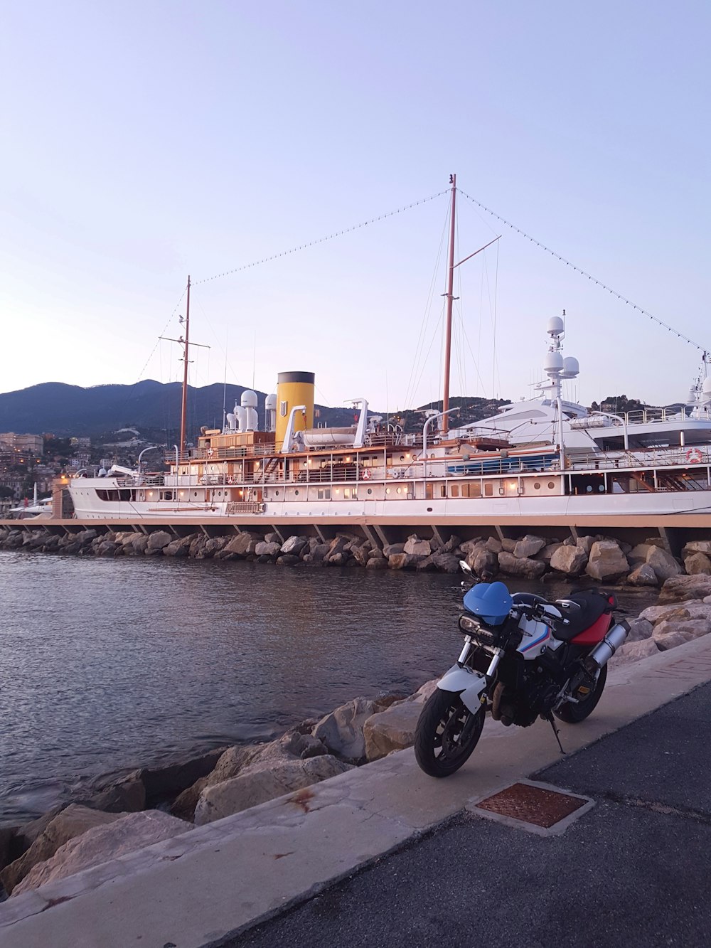 motorcycled parked near body of water