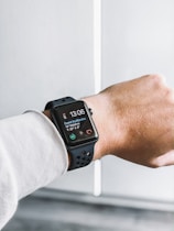 space black stainless steel Apple Watch at 13:05