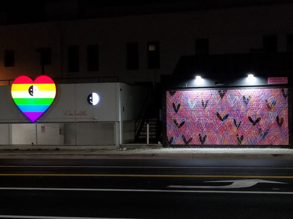 a building with a heart painted on the side of it