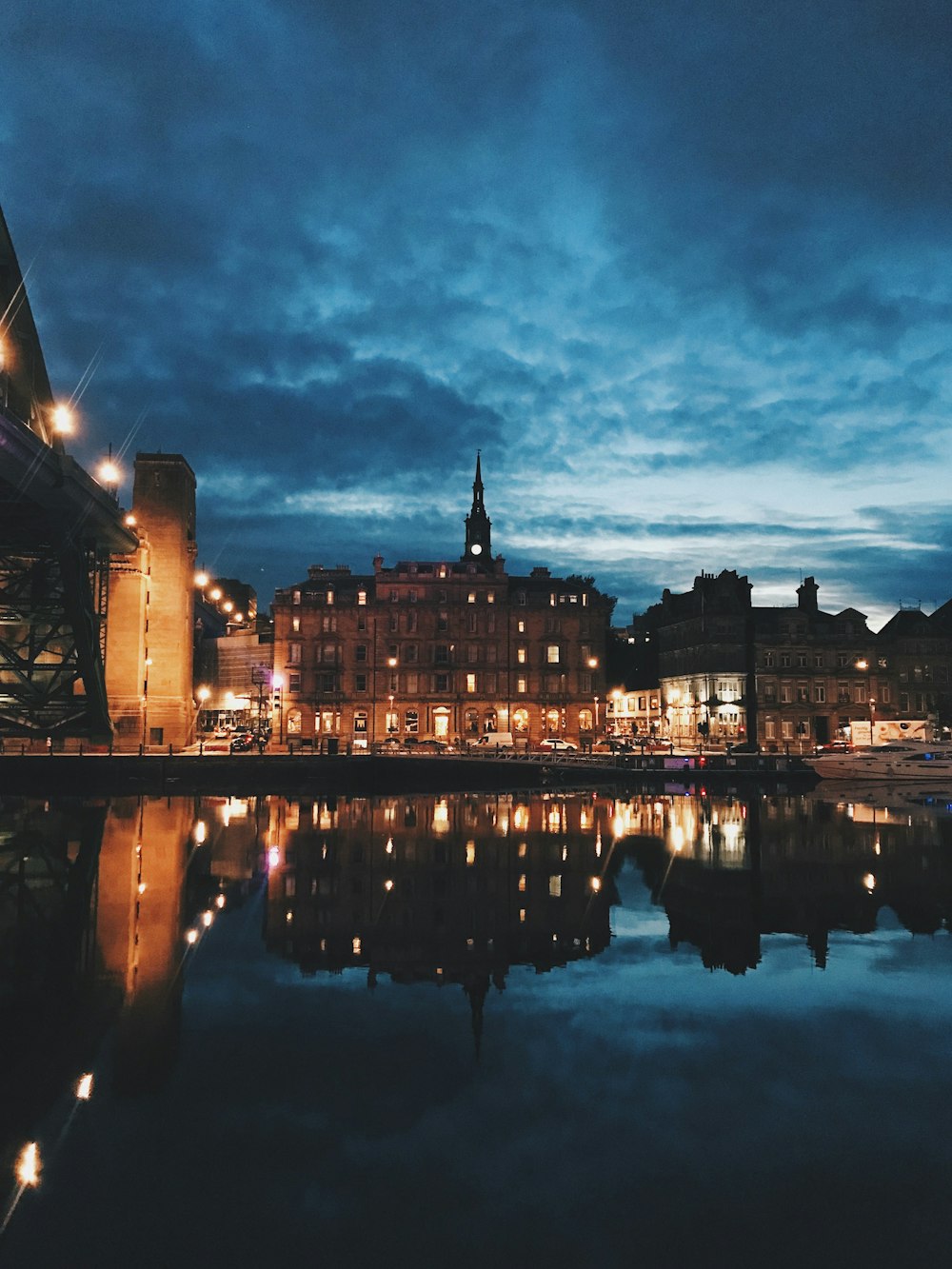 turned on lights inside buildings near water at night