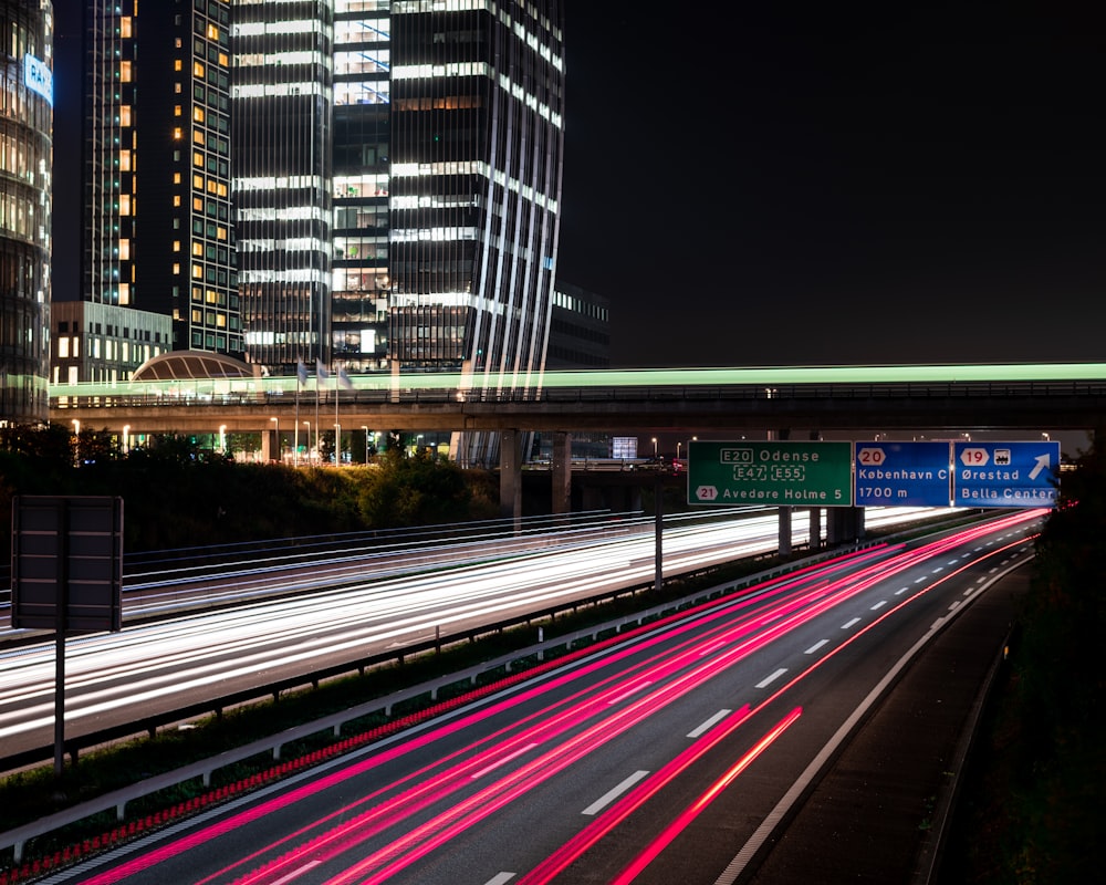 time-lapse photography of vehicle on road during night time