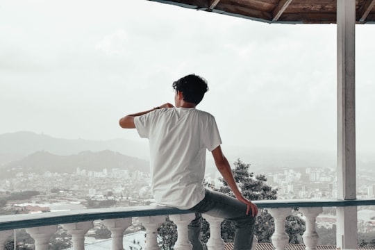 man sitting on balcon in Pereira Colombia