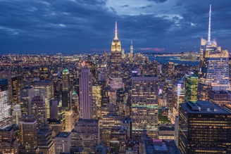 A vibrant city skyline at dusk, with glowing lights and bustling streets capturing the energy of a city break.