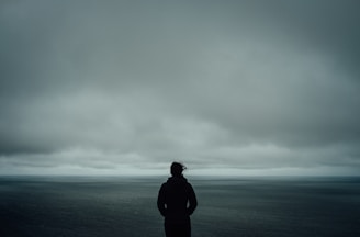 person standing near body of water