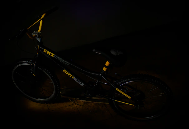 A BMX bike being gently loaded into the Velosafe vehicle, emphasizing careful handling.