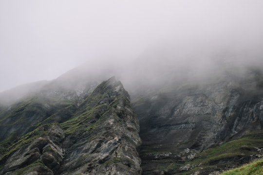 rock formation surrounded by fogs in Wengen Switzerland