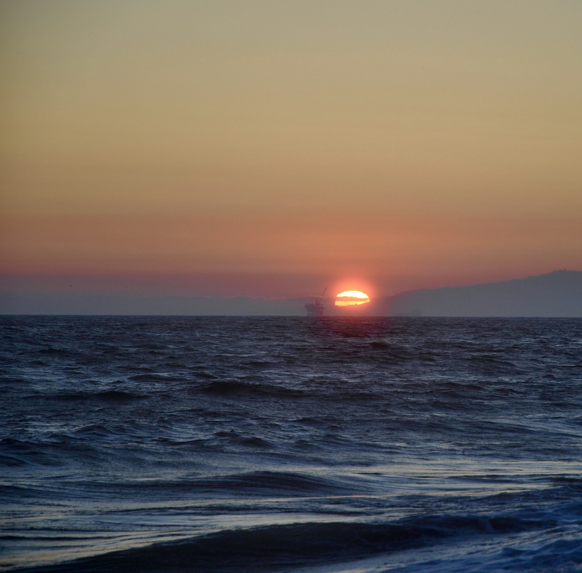 woman wearing yellow long-sleeved dress under white clouds and blue sky during daytime