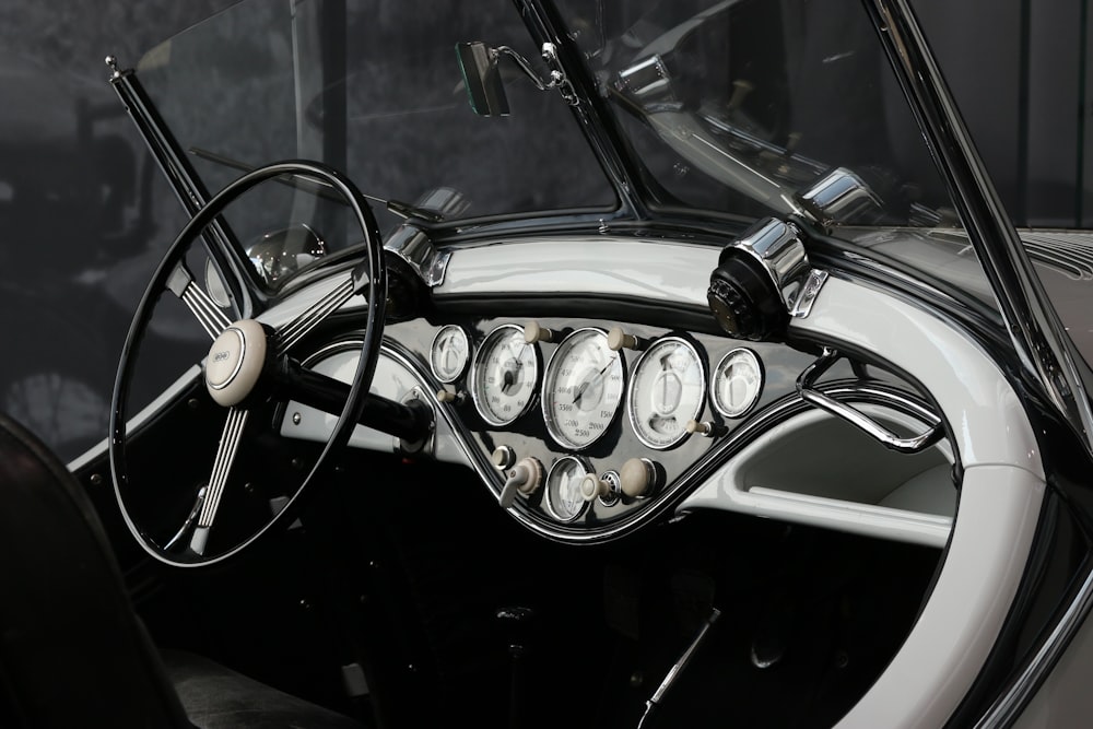 grayscale photo of vehicle steering wheel