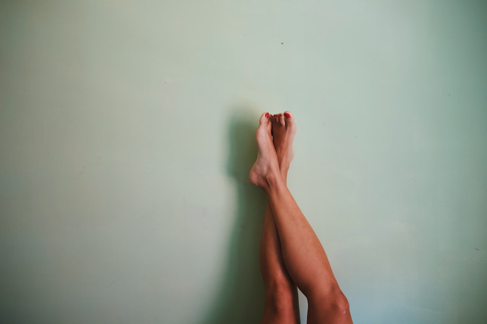 person leg on wall