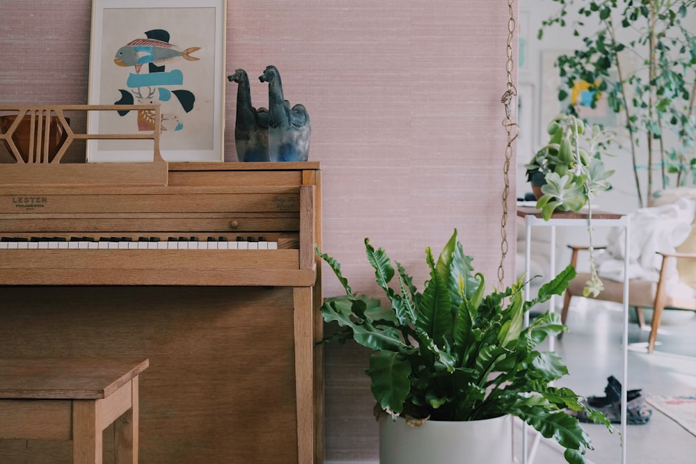 two duck figurines on top of spinet piano