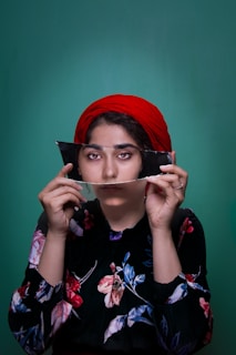 woman holding mirror shard