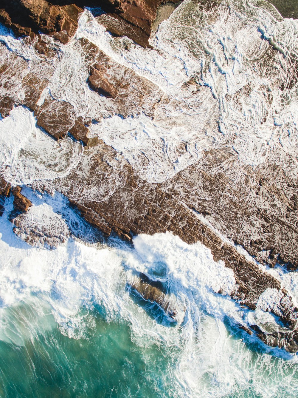 aerial photography of mountain near shore