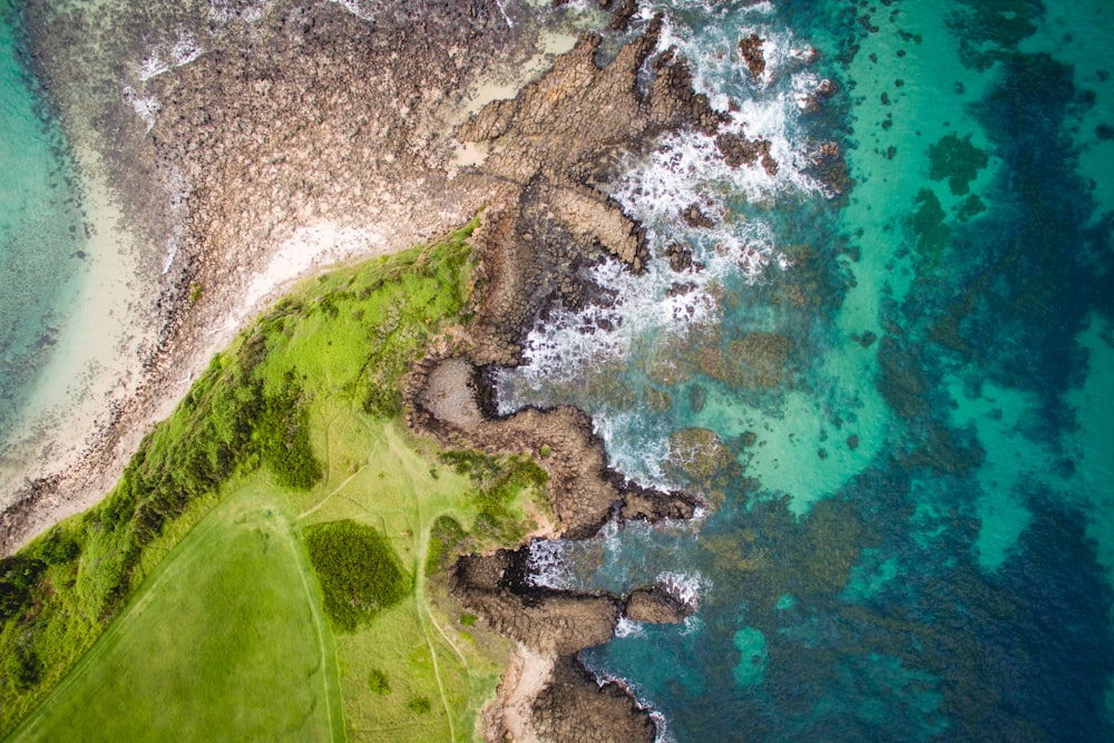 aerial photography of sea near hills