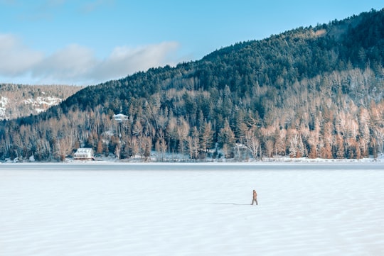 person standing on white sand in Mont-Tremblant Canada