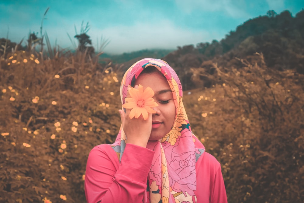 woman holding flower