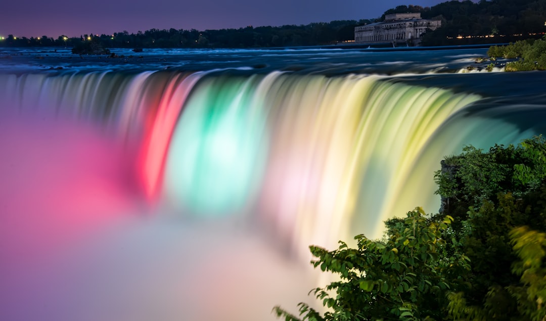 multicolored waterfalls, When it gets dark Niagara falls are lit up by lights from across the river. It took some timing