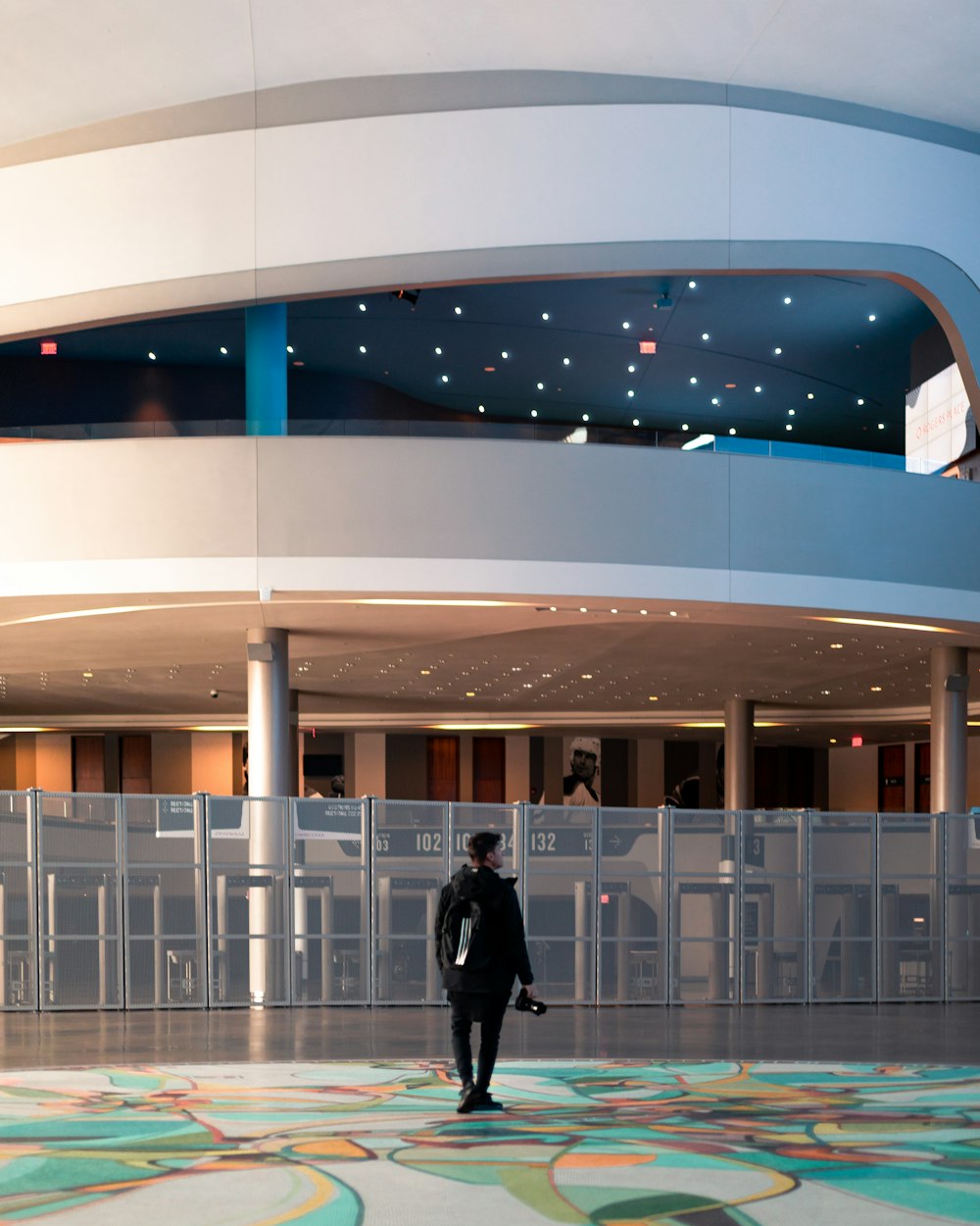 person standing near glass wall