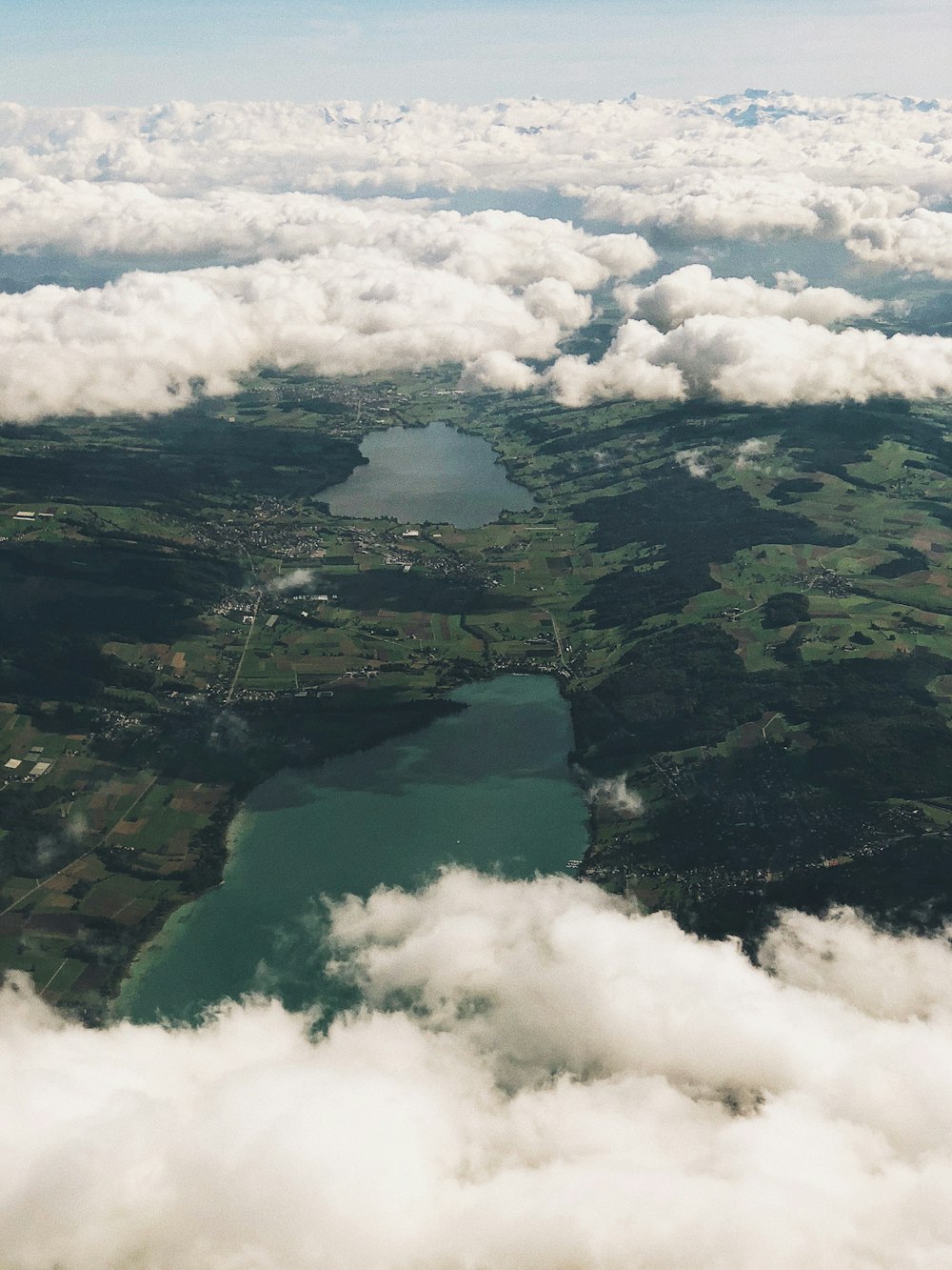 aerial photo of clouds and body of water