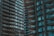 High-rise apartment buildings with numerous balconies and windows. The structures are closely positioned, creating an urban and dense architectural style.