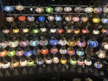 A collection of repaired lamps lined up on a wooden workbench, ready to brighten homes.