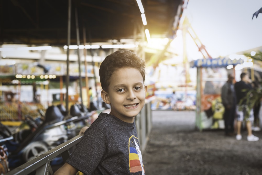 boy learning on metal frame