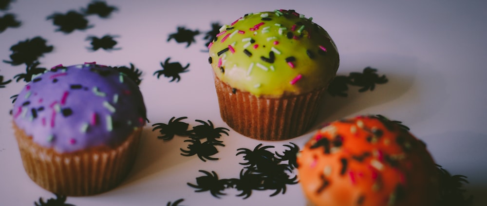 three assorted-flavor cupcakes