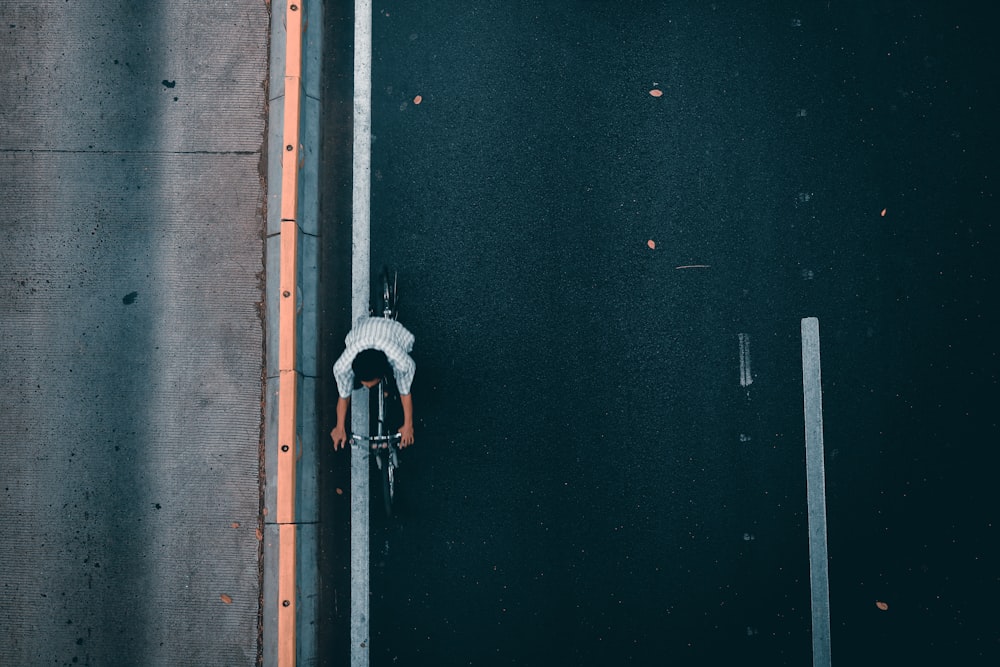 aerial view of person riding bike on the street