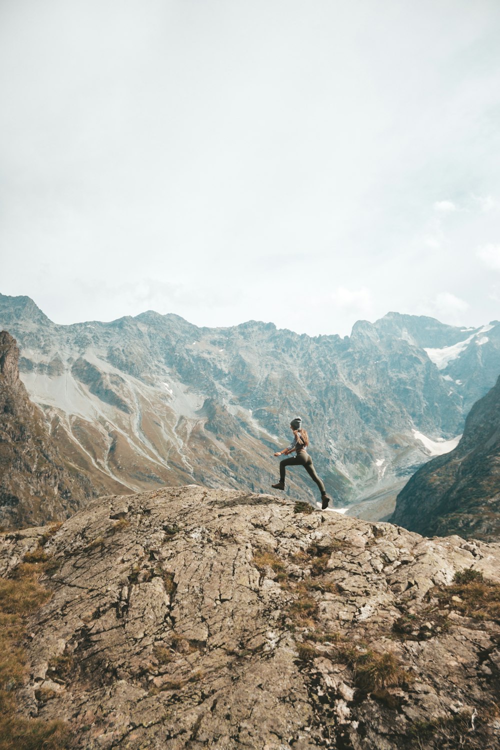 person standing on mountain scenery