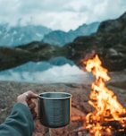 person holding mug