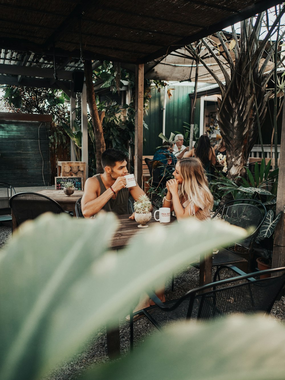 woman and man sitting in front of table