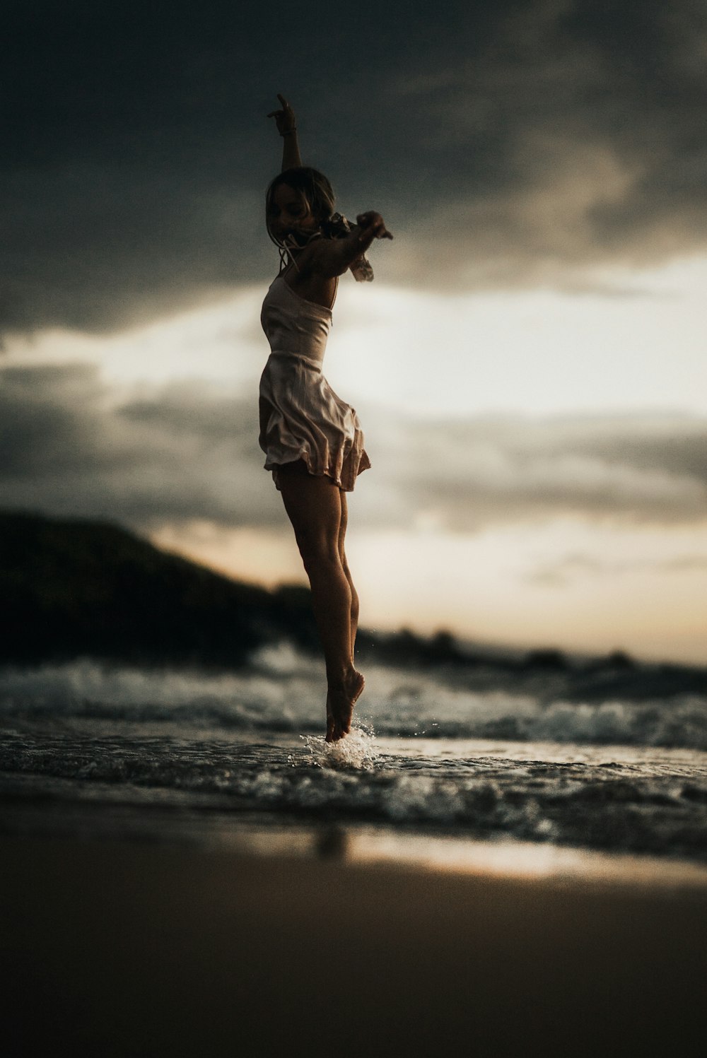 selective focus photography of woman jumps into water