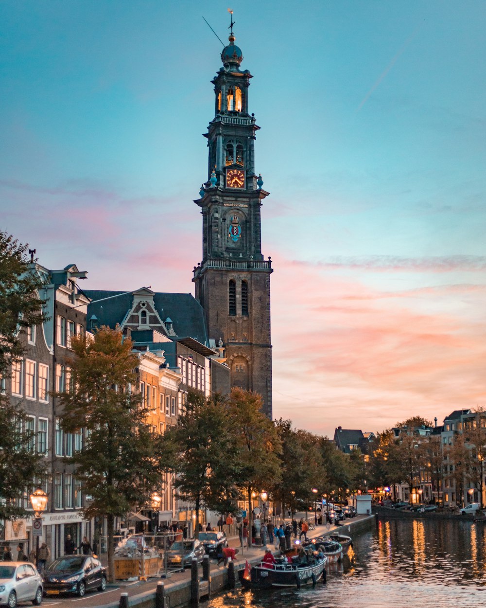 brown clock tower under golden sky