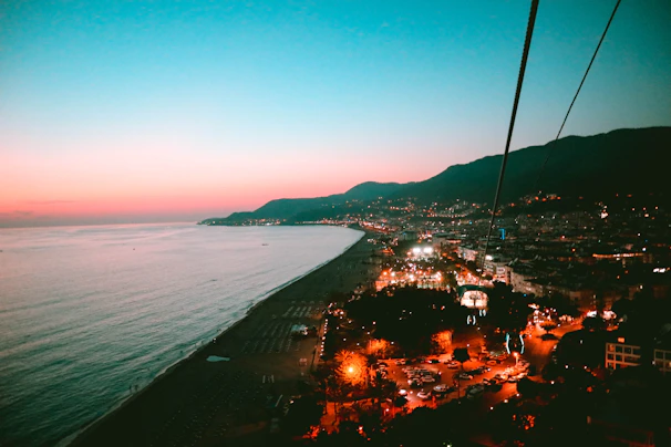 Panoramic view of the coastline at dusk with soft shadows and warm tones.